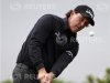 Phil Mickelson from the U.S. chips his ball onto the ninth hole green during the first round of the Scottish Open golf tournament at Castle Stuart golf course near Inverness, Scotland