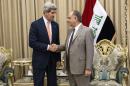 Iraqi Deputy Prime Minister Saleh al-Mutlaq, right, greets U.S. Secretary of State John Kerry before a meeting in the capital Baghdad, Iraq, Monday, June 23, 2014. Kerry said the fate of Iraq may be decided over the next week and is largely dependent on whether its leaders meet a deadline for starting to build a new government. (AP Photo/Brendan Smialowski, Pool)