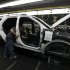 FILE - In this Dec. 1, 2010 file photo, plant employees assemble a 2011 Ford Explorer on the assembly line at Ford's Chicago Assembly Plant. Ford Motor Co. said Wednesday, May 22, 2013 that 21 of its North American factories will shut for only one week this summer. That includes the Chicago plant that makes the Ford Explorer SUV and the Mexican plant that makes the Fusion sedan.  (AP Photo/M. Spencer Green, File)