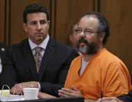Ariel Castro, right, speaks during the sentencing phase as defense attorney Craig Weintraub watches Thursday, Aug. 1, 2013, in Cleveland. Castro was sentenced to life in prison plus 1,000 years. (AP Photo/Tony Dejak)