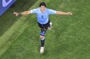 Uruguay's Luis Suarez celebrates scoring his side's second goal during the group D World Cup soccer match between Uruguay and England at the Itaquerao Stadium in Sao Paulo, Brazil, Thursday, June 19, 2014. (AP Photo/Francois Xavier Marit, pool)