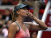 Russia's Sharapova blows a kiss to the crowd after winning her second round women's singles match against Romania's Cirstea at the China Open tennis tournament in Beijing