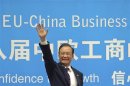 China's Premier Wen Jiabao waves during the European Union-China summit at the Egmont Palace in Brussels