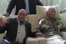 FILE : In this image taken from video, South African President Jacob Zuma, left, sits with the ailing anti-apartheid icon Nelson Madela is filmed Monday April 29, 2013, more than three weeks after being released from hospital. Mandela was treated in hospital for a recurring lung infection. South African President Jacob Zuma visited the former leader on April 29, but Mandela does not appear to speak during the televised portion of the visit, as he sits in an armchair, his head propped up by a pillow and with his cheeks showing what appear to be marks from a recently removed oxygen mask, although Zuma said he found Nelson Mandela 