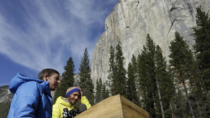 Tommy Caldwell, left, and Kevin Jorgeson speak during a news conference Thursday, Jan. 15, 2015, in El Capitan meadow in Yosemite National Park, Calif. The two climbers became the first in the world to use only their hands and feet to scale El Capitan, a sheer granite face in California&#39;s Yosemite National Park. (AP Photo/Ben Margot)