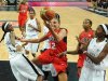 Taurasi of the U.S. vies with Angola's Guadalupe and Tomas during their Women's preliminary round group A basketball match in the London 2012 Olympic Games