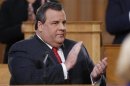 New Jersey Governor Chris Christie claps while giving his State of the State address in the assembly chamber in Trenton