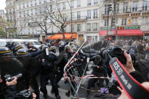 Protesters clash with riot police during a rally against &hellip;