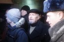 Interior Ministry officers detain Eduard Limonov, the leader of The Other Russia party, during a protest rally to defend Article 31 of the Russian constitution, which guarantees the right of assembly, in Moscow