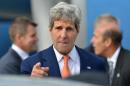 In this Monday, Aug. 11, 2014 file photo, U.S. Secretary of State John Kerry points a finger as he arrives in Sydney. In its latest personal attack on a prominent official, North Korea has called Kerry a wild dog with a "hideous lantern jaw." (AP Photo/Peter Parks, Pool)