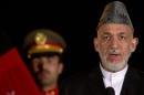 Afghan President Karzai speaks during a news conference with U.S. Secretary of State Kerry in Kabul