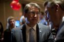 North Carolina Gov. Pat McCrory (C) speaks with guests at U.S. Rep. Thom Tillis's watch party at The Omni Hotel Ballroom on November 4, 2014, in Charlotte, North Carolina