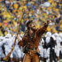 FILE This Saturday Sept. 22, 2012 file photo shows West Virginia University Mountaineer mascot Jonathan Kimble is seen during the NCAA college football game between West Virginia University and University of Maryland in Morgantown, W.Va. A video showing Kimble using his mascot rifle to hunt bear has gone viral.   (AP Photo/Brian Ach)
