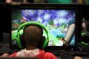Child plays video game Minecraft at the Minecon convention in London