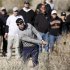 Mahan of the U.S. hits out of the bushes on the 17th hole during the championship match of the WGC-Accenture Match Play Championship golf tournament in Marana