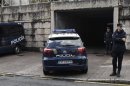 A police car arrives at the courthouse with Francisco Garzon inside in Santiago de Compostela