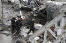 Rescue workers inspect the site of a collapsed supermarket in Riga