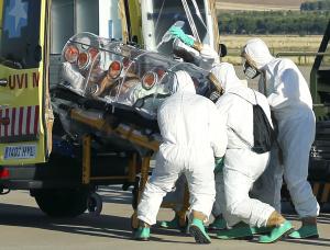 Health workers load Ebola patient, Spanish priest Miguel&nbsp;&hellip;