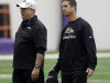 Baltimore Ravens head coach John Harbaugh, right, chats with defensive coordinator Dean Pees after NFL football practice at the team's training facility in Owings Mills, Md., Friday, Jan. 25, 2013. The Ravens are scheduled to face the San Francisco 49ers in Super Bowl XLVII in New Orleans on Sunday, Feb. 3. (AP Photo/Patrick Semansky)