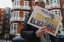 A supporter of Edward Snowden holds a sign outside the Embassy of Ecuador in London