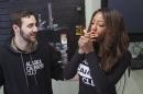 In this Feb. 20, 2015 photo, Peter Lomonaco, co-founder of the Alaska Cannabis Club, and CEO Charlo Greene share a joint at their medical marijuana dispensary in Anchorage, Alaska. On Tuesday, Feb. 24, 2015, Alaska will become the third state in the nation to legalize marijuana. (AP Photo/Mark Thiessen)
