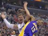 Los Angeles Clippers forward Blake Griffin, left, and Los Angeles Lakers forward Metta World Peace tangle during the first half of their NBA basketball game, Friday, Jan. 4, 2013, in Los Angeles.  (AP Photo/Mark J. Terrill)