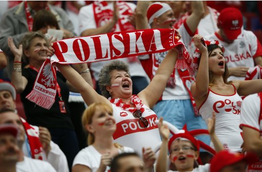 Poland fans cheer before the start of their Euro 2012 Group A soccer match against Greece at the national stadium in Warsaw