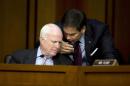 Sen. John McCain, R-Ariz., left, and Sen. Marco Rubio, R-Fla., talk on Capitol Hill in Washington, Wednesday, Sept. 17, 2014, during a Senate Foreign Relations Committee hearing on the U.S. strategy to defeat the Islamic State group. (AP Photo/Carolyn Kaster)