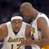 Los Angeles Lakers guard Kobe Bryant, right, chats with center Dwight Howard during the first half of the Lakers' NBA basketball game against the Cleveland Cavaliers, Sunday, Jan. 13, 2013, in Los Angeles. (AP Photo/Mark J. Terrill)