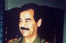 FILE - This January 1991 file photo shows Iraqi President Saddam Hussein, in Baghdad. A Syrian newspaper on Saturday, July 28, 2012, used a banner headline to proclaim a high-stakes fight for the city of Aleppo in the country's 17-month-old uprising 