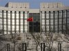A Chinese national flag is seen at the headquarters of the central bank of China in Beijing