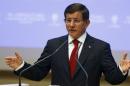 Davutoglu speaks during a meeting at his ruling AK Party headquarters in Ankara