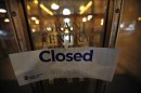 A closed sign is displayed on a door to Grand Central Terminal in New York