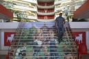Player avatars from Zynga's FarmVille 2 are seen on a stairway at the entrance to Zynga headquarters in San Francisco