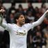 Swansea City's Michu celebrates scoring a goal during their English Premier League soccer match against Manchester United in Swansea