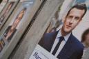 Macron hangs on to lead in French election, Le Pen's camp rows with Brussels