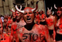 Bare-chested Pamplona marchers call for end to bull runs