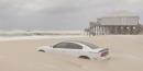 A car sank into the sand at an Alabama beach after its owner parked close to the shore ahead of Hurricane Barry