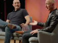 Watch Amazon CEO Jeff Bezos and his younger brother give a rare interview about growing up together (AMZN)