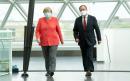 German media accuses Merkel of 'scare tactics' as she warns crisis is not over