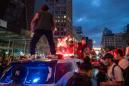 Protesters face life in prison over police car attacks in NY