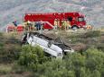 A charter bus swerved and rolled over on a California highway, killing 3 and injuring 18