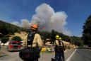 Firefighters outflank California blaze, last four missing found alive