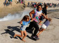 PHOTOS: Migrants try to breach border at Tijuana — U.S. agents fire tear gas