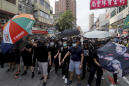 Clashes erupt as Hong Kong protest targets Chinese traders