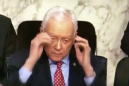 Senator reaches for nonexistent glasses and takes them off anyway