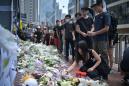 Flowers pile up for dead Hong Kong protester