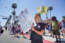 Thousands storm California beaches to protest closures