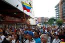 Venezuela opposition votes against Maduro, woman shot dead