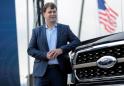 Ford's new CEO Farley promises urgency at automaker, shakes up management